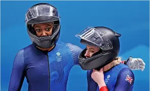  ?? PICTURE: Alex Pantling/getty Images ?? Mica Mcneill and Montell Douglas of Team GB look on after sliding during the 2-women Bobsleigh heats