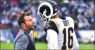  ?? FREDERICK BREEDON / GETTY IMAGES / AFP ?? Los Angeles Rams head coach Sean McVay consults with quarterbac­k Jared Goff during the Rams’ 27-23 victory over the Tennessee Titans at Nissan Stadium in Nashville, Tennessee, on Sunday.