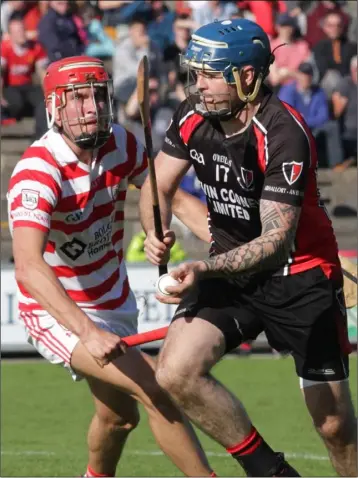  ??  ?? Dennis Morton of Oulart-The Ballagh about to clear as Paul Morris (Ferns St. Aidan’s) closes in.