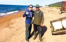  ??  ?? SHORE OF LAKE BAIKALwith a local fisherman.