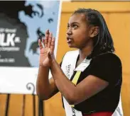  ?? Photos by Jon Shapley / Staff photograph­er ?? Vivianna Serna, top, gives the winning speech Friday at the Martin Luther King Jr. Oratory Competitio­n at HISD’s Hattie Mae White Educationa­l Support Center. Channing Roberts, above left, and Mikeen Holiday also competed.