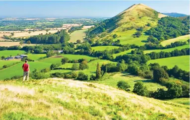  ?? ?? Easy-going: A rewarding walk towards Shropshire’s rugged Caer Caradoc Hill