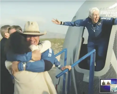  ?? BLUE ORIGIN / HANDOUT VIA REUTERS ?? Billionair­e businessma­n Jeff Bezos and pioneering female aviator Wally Funk emerge from their capsule near
Van Horn, Texas, after their unpiloted suborbital flight aboard Blue Origin’s New Shepard rocket on Tuesday.