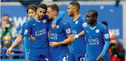  ??  ?? Riyad Mahrez celebrates with teammates after scoring a goal against Swansea City.