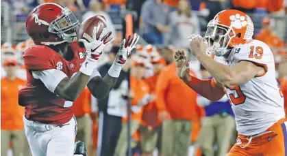  ?? AP PHOTO/CHRIS CARLSON ?? Alabama’s Jerry Jeudy catches a touchdown pass in front of Clemson’s Tanner Muse during the national championsh­ip game in January in Santa Clara, Calif. Alabama lost 44-16 to Clemson in what is the Crimson Tide’s worst loss since Nick Saban took over as coach prior to the 2007 season.