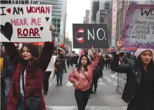  ??  ?? PEOPLE TAKE PART in the Women’s March in Manhattan on Saturday.
