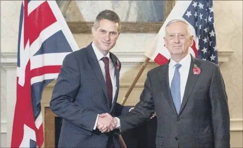  ?? PICTURE: RICK FINDLER/PA WIRE. ?? SPECIAL RELATIONSH­IP: Defence Secretary Gavin Williamson and US Defence Secretary James Mattis shake hands at the Ministry of Defence in London.