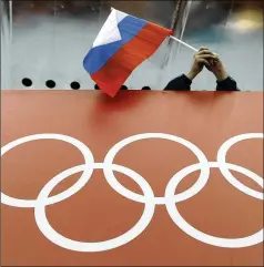  ?? DAVID J. PHILLIP / ASSOCIATED PRESS ?? A Russian flag is seen during the 2014 Winter Olympics in Sochi, Russia. A World Anti-Doping Agency (WADA) panel on Monday recommende­d Russian athletes be forced to compete as neutrals at the 2020 Olympics in Tokyo and other major upcoming events.