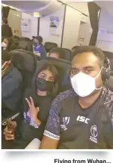  ??  ?? Flying from Wuhan...
Sylvia Nandani and Joe Racaca onboard the Air New Zealand flight assisted evacuation.