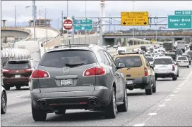  ?? DAVID ZALUBOWSKI / ASSOCIATED PRESS ?? Motorists sit in backed-up traffic on Interstate 25 in Denver on Friday as the Memorial Day travel weekend got underway. AAA estimated that about 38 million people would travel for the holiday, most of them driving.