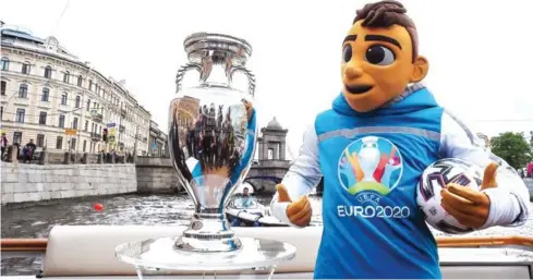  ?? AFP ?? Euro 2020 mascot Skillzy poses with the trophy in central Saint Petersburg on May 22.