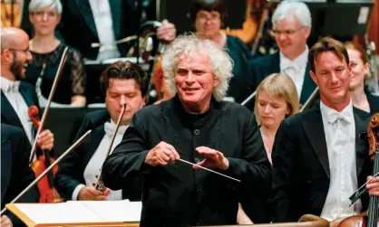  ?? Photograph: Tolga Akmen/AFP/Getty Images ?? Sir Simon Rattle conducting the London Symphony Orchestra at the Barbican in London.