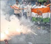  ?? PTI ?? Congress party workers celebrate Patel’s victory.