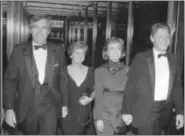  ?? THE NORTHWEST ARKANSAS DEMOCRAT-GAZETTE VIA AP, FILE ?? In this file photo, Vince Foster, left, walks with his wife and then Gov. Bill Clinton and his wife Hillary Rodham Clinton, in Little Rock, Ark.