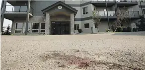  ?? DAVID BLOOM ?? A blood stain is visible in the parking lot of the Hollick Kenyon Estates at 16235 51 St., following a fatal shooting there Monday.