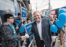  ?? AARON VINCENT ELKAIM/THE CANADIAN PRESS ?? Ontario Progressiv­e Conservati­ve Leader Doug Ford greets supporters at the Mark DeMontis campaign office opening in Toronto on Sunday.