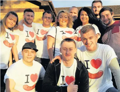  ?? PICTURES: RICHARD SWINGLER ?? Friends of Dylan Williams wear their I Love Sausage T-shirts