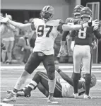  ?? JIM MONE/AP ?? Cleveland Browns defensive tackle Malik Jackson (97) celebrates after making a tackle against the Minnesota Vikings on Sunday in Minneapoli­s. The Browns won 14-7.