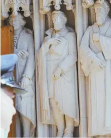  ?? AP PHOTOS ?? PUT AWAY: After a statue of Gen. Robert E. Lee was defaced, above, Duke University officials removed it early yesterday from its place among other historical figures outside the Duke Chapel.