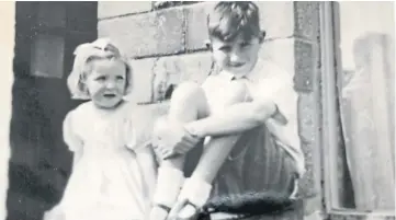  ?? ?? Mary and Gordon Anderson sitting on the coal bunker in front of their home in Ellengowan Drive, Dundee, in 1950. Read Gordon’s look back at his happy city childhood above.