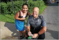  ??  ?? Kennett Township Police Officer Adam Cramer and Brittany of Kennett Square get together to compare their favorite books, colors and food.