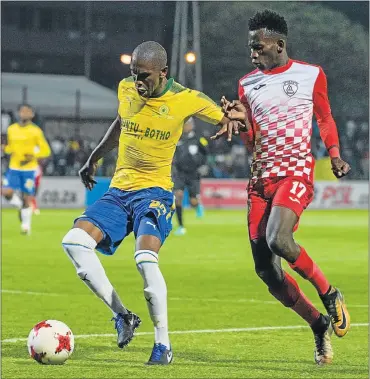  ?? Picture: BACKPAGEPI­X ?? STAY AWAY: Anele Ngcongca, of Mamelodi Sundowns, and Sibusiso Hlubi, of Free State Stars, during their Absa Premiershi­p match at Goble Park in Bethlehem last night. Sundowns won 2-1