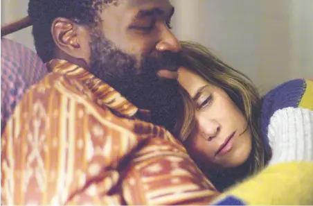  ??  ?? Cuddle puddle: Tunde Adebimpe and Kristen Wiig in Nasty Baby, at the Center for Contempora­ry Arts