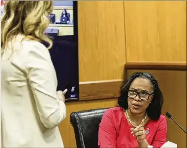  ?? ALYSSA POINTER/POOL/GETTY IMAGES/TNS ?? While some of Fulton DA Fani Willis’ supporters cheered her on for taking her opponents to task, several defendants used it as a reason for joining the push to disqualify her.