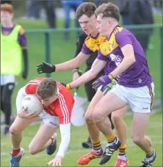  ??  ?? Paul Brennan (Louth) closed down by Alan Mahoney and Jack Higgins.