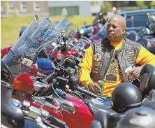  ??  ?? MEETING THE NEED: Vinny ‘Flex’ Green, above, relaxes at the Buffalo Soldiers Buddy Run, right, yesterday.