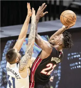  ?? AL DIAZ adiaz@miamiheral­d.com ?? The Heat’s Jimmy Butler is not concerned with how many points he scores. ‘My job is to help win games. That’s on both ends of the floor,’ he said.