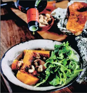  ?? ?? Halve a butternut and braai it wrapped in foil for about 40 minutes for a vegetarian treat. PICTURE: SUPPLIED