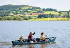  ??  ?? ‘Where mountains loom, lakes and rivers abound’: go canoeing on Llangorse lake