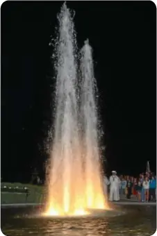  ??  ?? The twin fountains of the Garden of Reflection cascade toward the heavens during the evening Remembranc­e in Light. (photo by Jeff Goldberg)