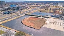  ?? OKLAHOMAN] ?? OnCue is set to build on the site of the former Founders Bank and parking lot once attached to the former Wyndham Hotel, as shown in this drone image looking southeast from Founders Boulevard by Northwest Expressway and N May Avenue. [DAVE MORRIS/ THE