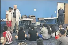  ?? BEARD/ DISPATCH] [KAYLA ?? Jim Flanagan, 73, left, and Frank McGarvey, 79, tell stories and pass out books to kids at the Ohio Hispanic Coalition East as part of the Columbus Story Adventures program.