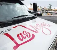  ?? Erik Verduzco ?? Las Vegas Review-journal @Erik_verduzco A Downtown Loop shuttle shows off the redesigned Las Vegas logo. City officials decided after 10 months to revert to the official seal as the promotiona­l image.