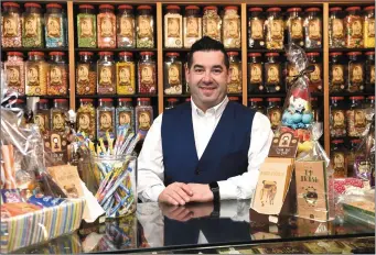  ?? Photo by Michelle Cooper Galvin ?? PJ O’Sullivan at the counter of his confection­ary emporium in Killarney, Aunty Nellie’s - ahead of his planned skydive in aid of the homeless on the June Bank Holiday weekend.