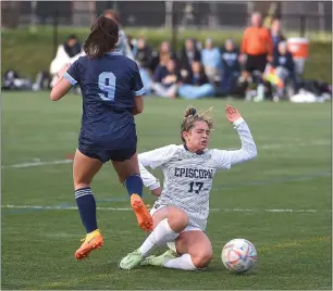  ?? PETE BANNAN — MEDIANEWS GROUP ?? Episcopal Academy’s Lainey McGonagle, right, slides in on a tackle on Springside Chestnut
Hill forward Bella Brown Wednesday afternoon in the PAISAA girls soccer final at the Proving Grounds in Conshohock­en.