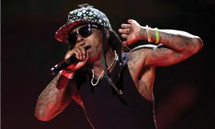  ??  ?? Lil Wayne pleaded guilty last month to possessing a loaded, gold-plated handgun when his chartered jet landed in Miami in December 2019. Photograph: Steve Marcus/Reuters