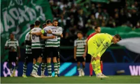  ?? Photograph: Alexandre Simões/Borussia Dortmund/Getty ?? Dortmund’s Steffen Tigges expresses his disappoint­ment at the final whistle as Sporting celebrate reaching the last 16.