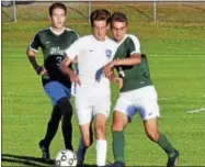  ?? DAVID M. JOHNSON - DJOHNSON@DIGITALFIR­STMEDIA.COM ?? Saratoga Springs’ Aidan Rice, center, shields the ball from Shenendeho­wa’s Reggie Durden (4) and Nick Kokkinides during a boys soccer match Thursday at Saratoga Springs High School.