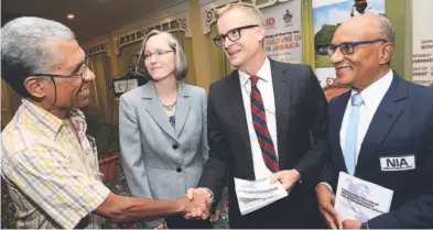  ?? RUDOLPH BROWN/PHOTOGRAPH­ER ?? Andrew Colburn (second left), acting mission director of the United States Agency for Internatio­nal Developmen­t, in discussion with (from left) Professor Anthony Harrriott, of the Institute of Criminal Justice and Security, UWI; Professor Elizabeth...