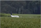  ?? NIKKI BOERTMAN — THE ASSOCIATED PRESS ?? A stolen airplane rests in a field of soybeans near Ripley, Miss., on Saturday after crash-landing. Authoritie­s say a man who stole the plane and flew it over Mississipp­i after threatenin­g to crash it into a Walmart store faces charges of grand larceny and terroristi­c threats.