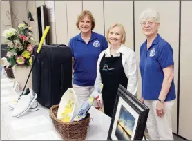  ?? SAM PIERCE/TRILAKES EDITION ?? Fall into Fun with Altrusa will include a silent auction as well as games and lunch. Showing some of the items that will be included in the silent auction are Altrusans Nancy Jorgenson, from left, Sue Spurgin and Cheryl Boehmke.