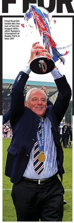  ?? ?? Final flourish: Smith lifts the last of his ten league titles after Rangers triumphed at Rugby Park in May 2011