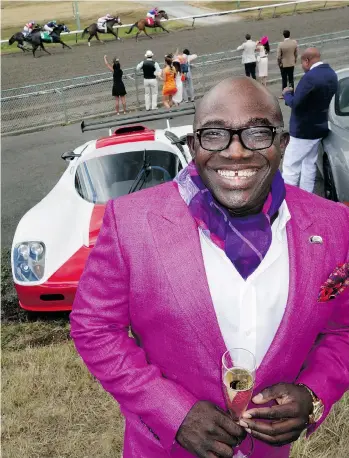  ??  ?? Live thoroughbr­eds galloped by as David Bentil — champagne flute in hand — showed a 500-horsepower Ultima GT-R coupe alongside his Mile’s End Motors pavilion at Hastings Racecourse’s Deighton Cup event.