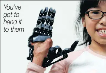  ?? PICTURE: REUTERS ?? Angel Peng, 8, who injured her hand in a scalding accident when she was nine months old, wearing a 3D-printed prosthetic hand designed and built by engineer Chang Hsien-Liang, in Taoyuan, Taiwan.