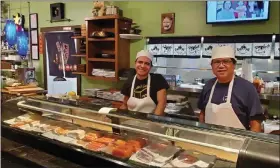  ?? DALLAS HELTZELL — BIZWEST ?? Andrew Sun, right, owner of Sushi Hana in Longmont, works alongside sushi chef Victor Reynoso. The building at 2065N. Main St. started as a bar and then went through several restaurant incarnatio­ns including a Vietnamese café before Sun acquired it.