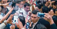  ??  ?? KUALA LUMPUR: Philippine’s President Rodrigo Duterte (center) leaves after meeting with Philippine nationals living in Malaysia during an official visit in Kuala Lumpur yesterday. Duterte is on his first official visit to Malaysia. —AFP